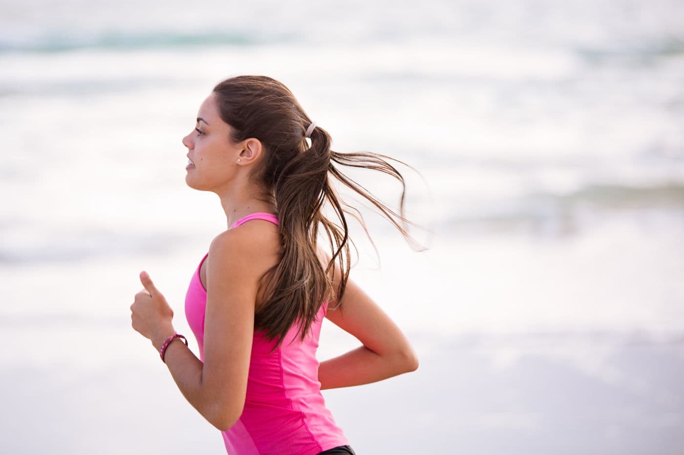 Woman running outdoors — casual movement