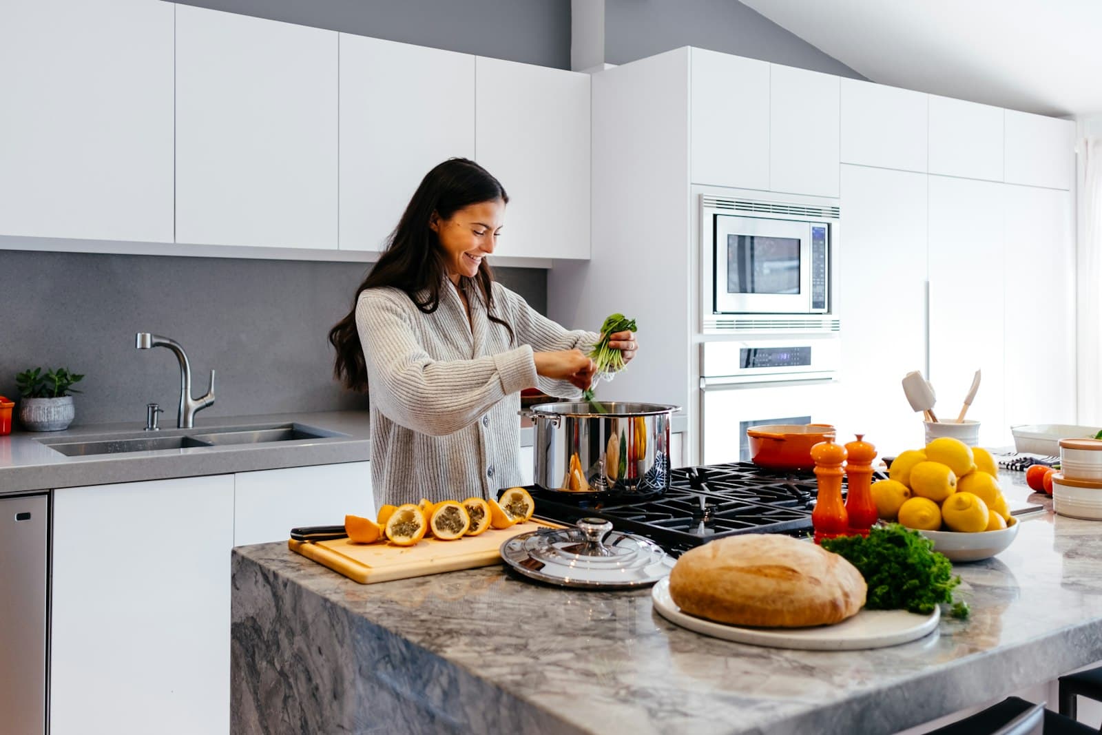 Woman preparing a healthy meal at home in the kitchen